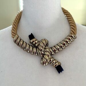 Satin robed choker with silver detailed center piece with blue stone tips